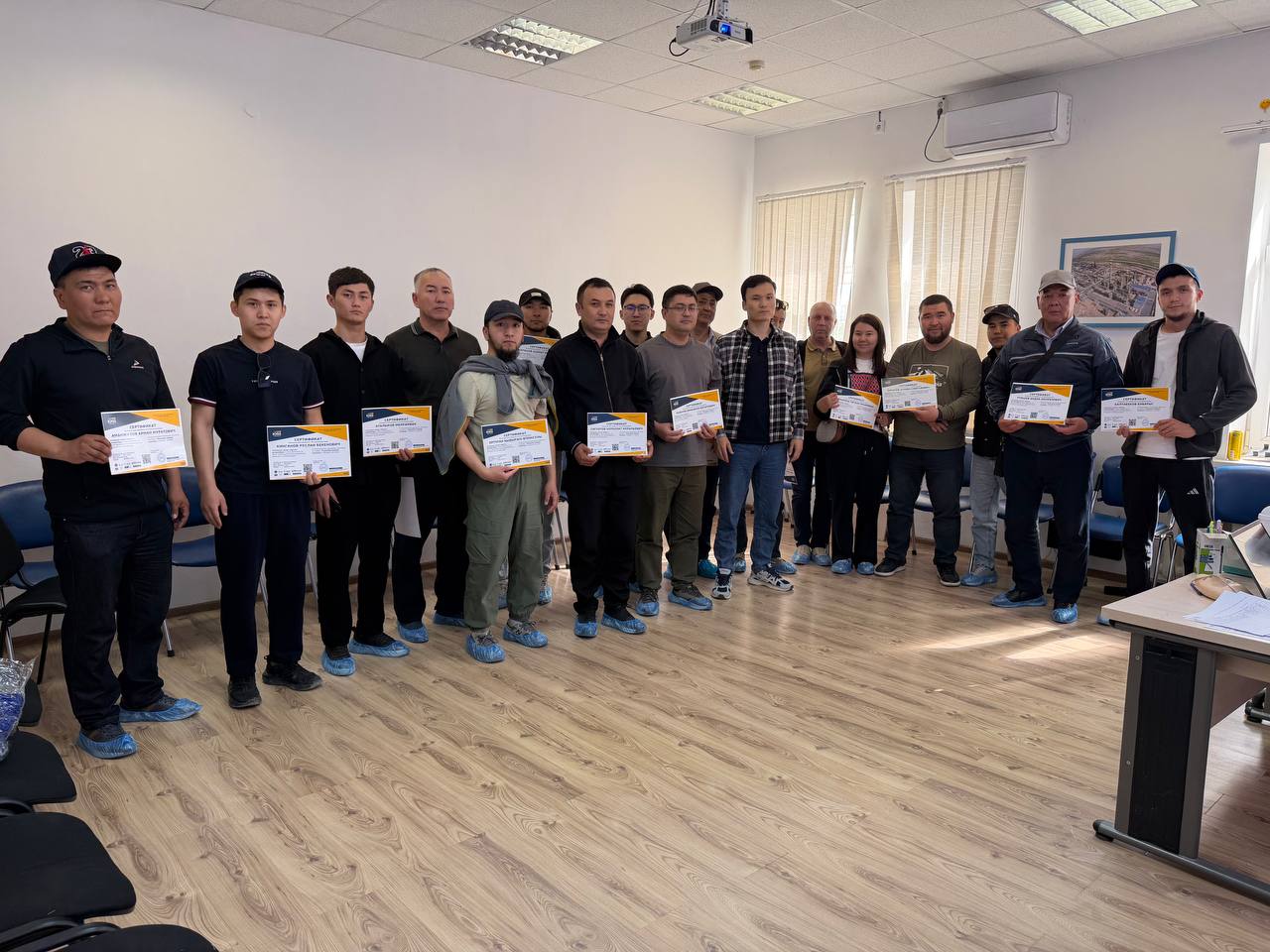 Participants receiving their certificates at the end of an IOSS course